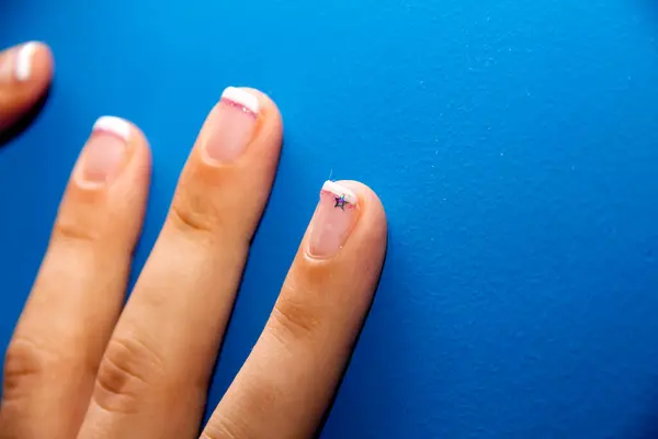 nail polish with a finger.