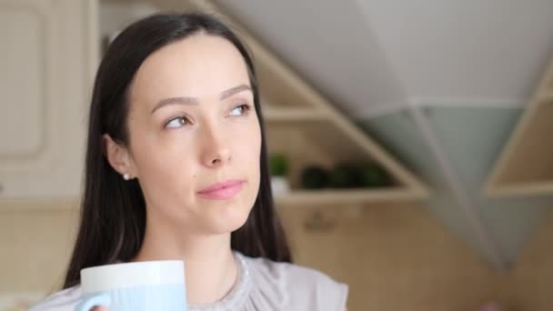 Close Portrait Beautiful Brunette Sitting Kitchen Cup Coffee Looking Somewhere — Stock Video