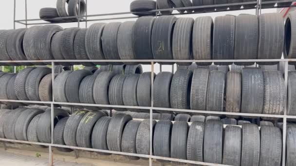 Large Number Black Rubber Car Tires Rack Car Service Shop — Stock Video