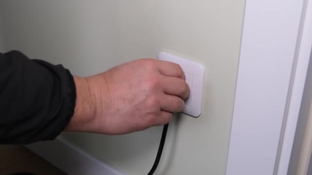 Black Cord Plug Electrical Appliance Turns Mans Hand Socket — Stock Video