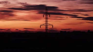 Energy crisis in Ukraine. Power outage of the city on the background of the sky with dark clouds. Time lapse over night city. Blackout in Ukraine