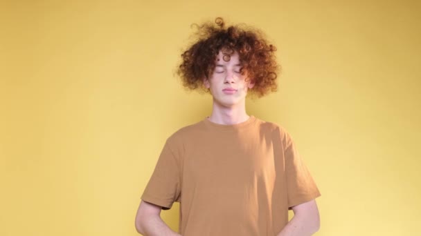 Curly Red Haired Man Expressing Displeasure Gesturing Hands Yellow Background — Stok Video