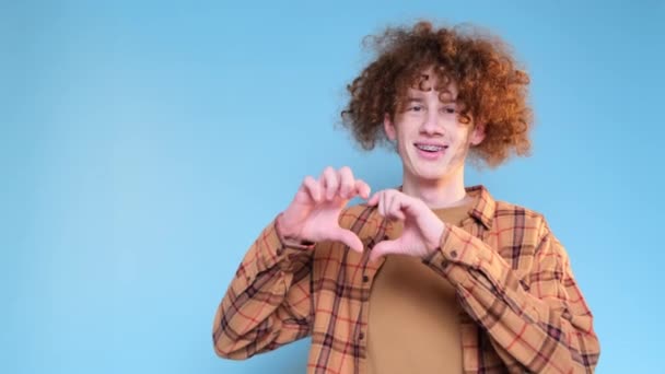 Handsome Red Haired Man Makes Heart Gesture Blue Background Valentines — Video