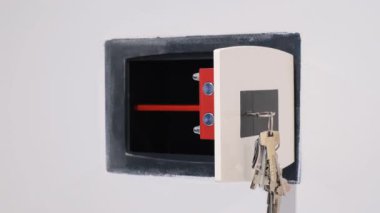 Close-up of a man putting money in a safe. Saving money at home. 4k video