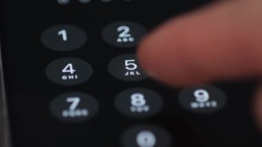 Entering a password on a smartphone. Video macro shooting. 4k video