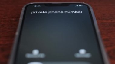 Screen incoming call from an unknown number on a black background. 4k video