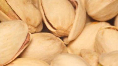 Close-up of a pistachio in the shell spinning in a circle. Healthy eating and vegan food concept.