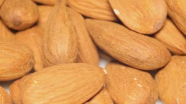 Macro video of almonds in shell rotating. Concept of healthy eating and raw food. Vegan food