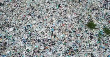 Shooting from the height of a pile of garbage, a large garbage dump of the city. Environmental problems. The problem of processing and disposal of waste