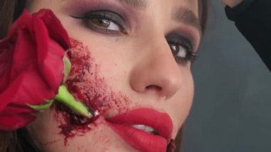 Beautiful woman with make-up for the Day of the Dead celebration in Mexico. Film grain. 4k video