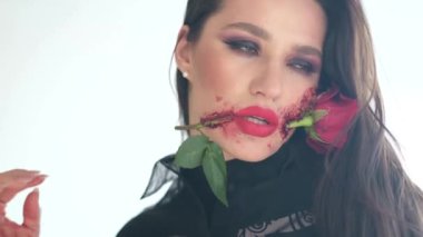 Beautiful woman with make-up for the Day of the Dead celebration in Mexico. Film grain. 4k video