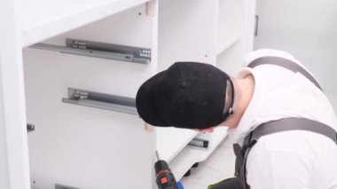 Adjusting the door locks in the pipes in the kitchen. Calling the master to the house. Apartment renovation concept. 4k video