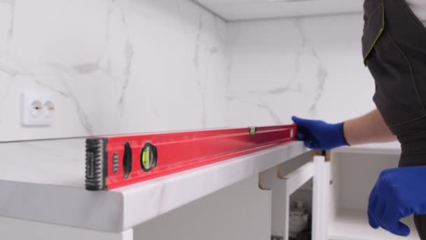 Repairman Assembles Furniture Kitchen Uses Level Tool Professional Installation Furniture — Video