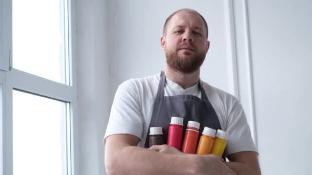Handsome Young Bearded Artist Stands Holds Tubes Paints Happy Artist — Video Stock