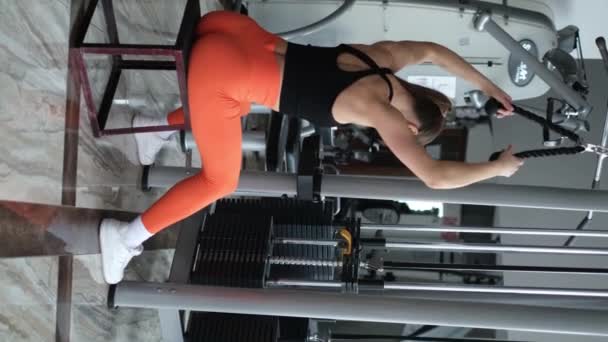 Vertical Video Young Sports Girl Trains Her Arm Muscles Performs — Vídeo de stock