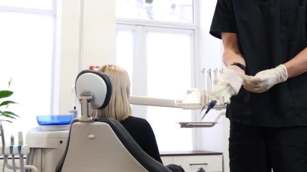 Preparation Dental Treatment Modern Dental Office Dentist Puts Work Gloves — Stock video