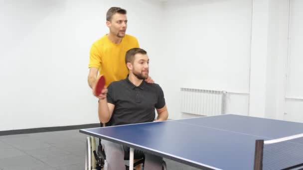 Young Man Wheelchair Trains Professional Coach Ping Pong Table Tennis — Stockvideo