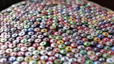 A large number of colored finger batteries. Movement in a circle. Used AA batteries