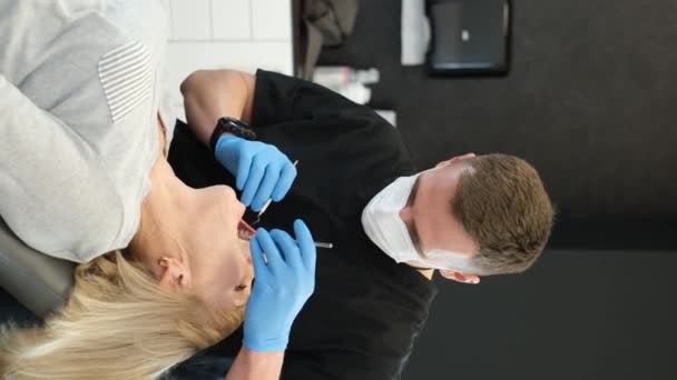 Vertical Video Beautiful Senior Woman Dentist Having Her Teeth Treated — Stock video