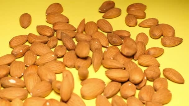 Close Almonds Isolated Yellow Background Almond Turns Shot — 图库视频影像