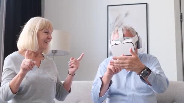 Happy Grandparents Relaxing Sitting Sofa Using Virtual Reality Glasses Happy — Vídeos de Stock