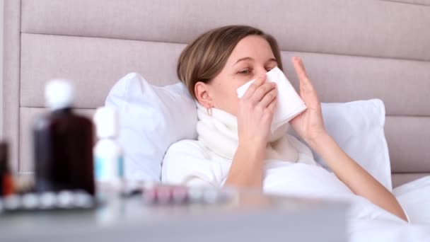 Young Woman Sneezes Tissue White Bed Bedroom Flu Allergy Concept — Vídeo de stock