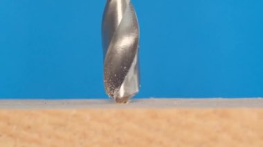 Super slow motion 240 fps, Drill making a hole in wood. Macro video