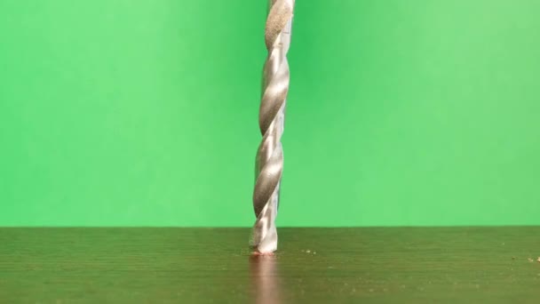 Steel Drill Green Background Used Drill Holes Wood Slow Motion — Vídeo de Stock