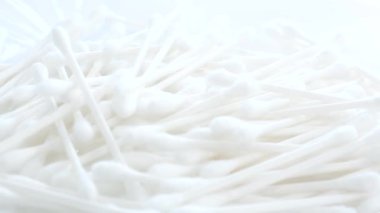 Many cotton swabs for cleaning human ears isolated on white background. Ear sticks are safe to use. 4k video