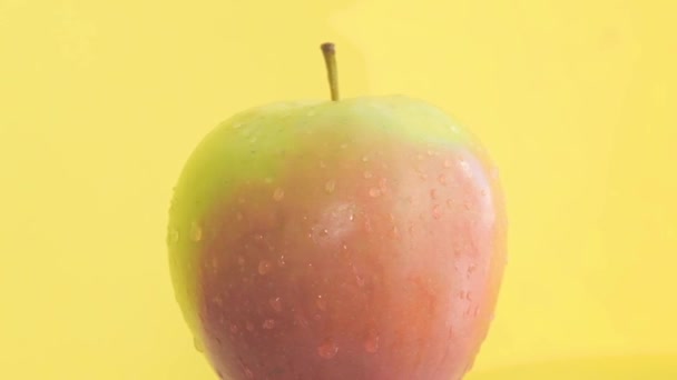Close Apple Water Drops Isolated Yellow Background Studio Slow Motion — Stock video