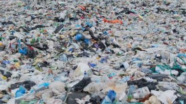 Garbage brought by the ocean is a garbage platform. The concept of environmental pollution. The global problem of plastic waste in the world