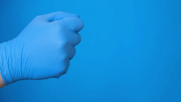 Doctors Hand Rubber Gloves Counts His Fingers Chromakey Blue Background — Stock video