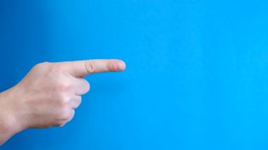 Man Pointing Finger Away on Chroma Key Background with Blue Background. Slow motion