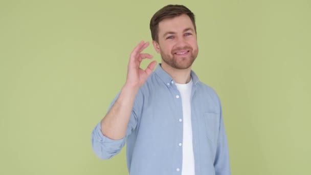 Handsome Young Man Wearing Denim Shirt Olive Background Smiling Positively — Vídeo de Stock
