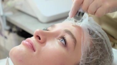Vacuum hydropiling procedure for facial rejuvenation. Professional beauty salon