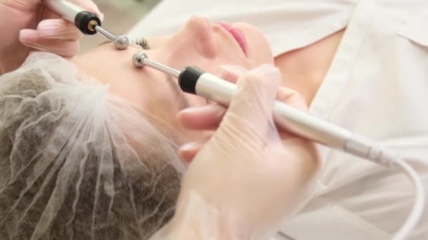 Young Girl Undergoes Microcurrent Galvanic Face Lift Using Electrodes Acne — Video