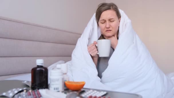 Portrait Young Woman Who Has Sars Drinks Warm Tea Isolation — Stockvideo