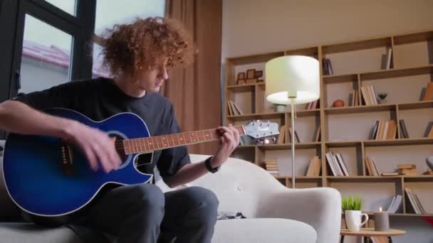 Young Curly Musician Blue Guitar Very Tired Irritated Young Guitarist — Stock Video