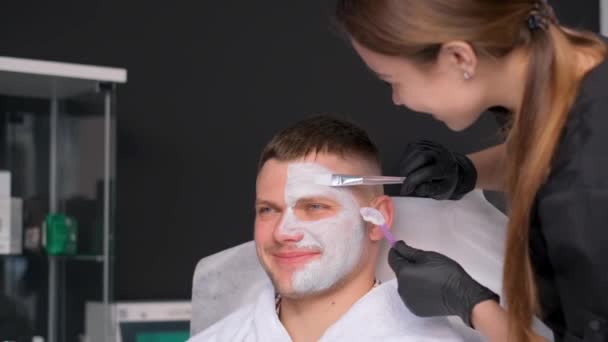 Young Man Spa Having Facial Treatment Clay Mask Persons Face — Stock Video