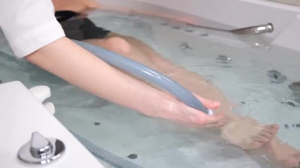 Young Woman Lies Her Back Bathtub Hydromassage Professional Water Procedures — Stock Video
