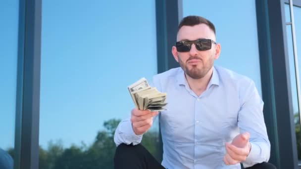 Confident Young Man Tells How Make Money Businessman Dollars Hands — стоковое видео