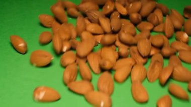 Slow motion of moving pistachio nuts. High quality FullHD video.