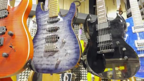 Store Electric Guitars Various Colors Concept Musical Instruments — Stockvideo