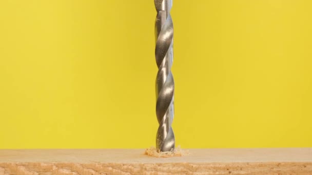 Close Drilling Holes Wood Drill Drill Rotates Yellow Background — Vídeo de Stock