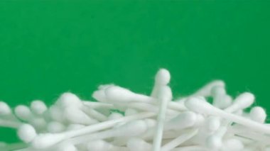 Pile of plastic cotton swabs or buds top view close-up.