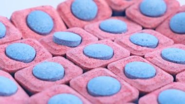 Tablets of detergent for a dishwasher, close-up.