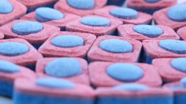 Close-up of dishwasher capsules. Dishwashing concept. 4k