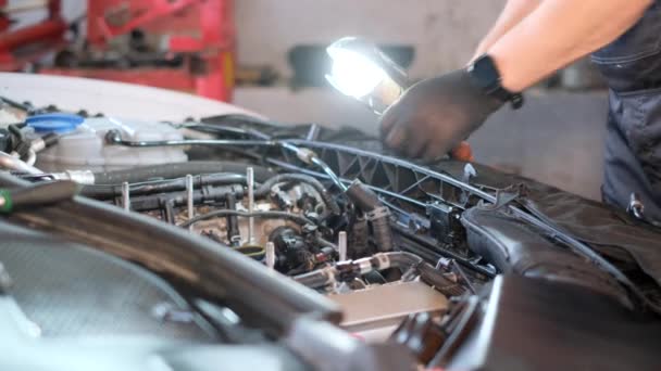 Mechanic Looks Hood Car Man Gray Uniform Repairing Car Indoors — Vídeo de stock