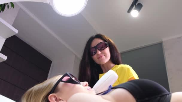 Cosmetologist Protective Glasses Performs Laser Hair Removal Young Woman Care — Stock videók
