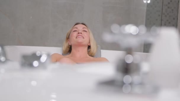 Portrait Charming Woman Sitting Relaxed Hydromassage Bathtub Luxury Spa Salon — стоковое видео